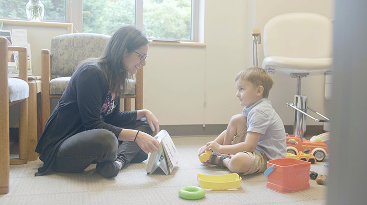 A speech pathologist working with a child