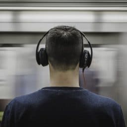 man listening to music with headphones