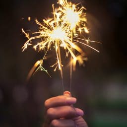 person holding a sparkler firework