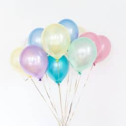 A colorful array of balloons against a white background.